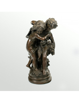 Bronze statue of two children carrying a bouquet of flowers, signed Auguste Moreau